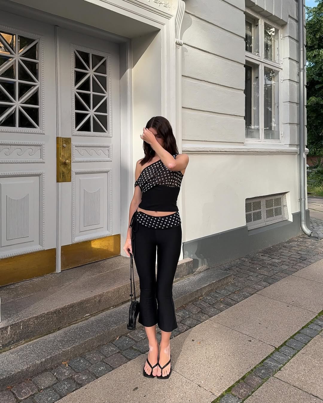 Marina in leggings and polka-dot top