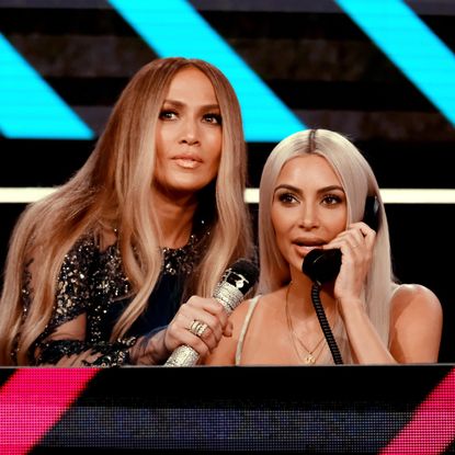 In this handout photo provided by One Voice: Somos Live!, Jennifer Lopez (L) and Kim Kardashian participate in the phone bank onstage during "One Voice: Somos Live! A Concert For Disaster Relief" at the Universal Studios Lot on October 14, 2017 in Los Angeles, California