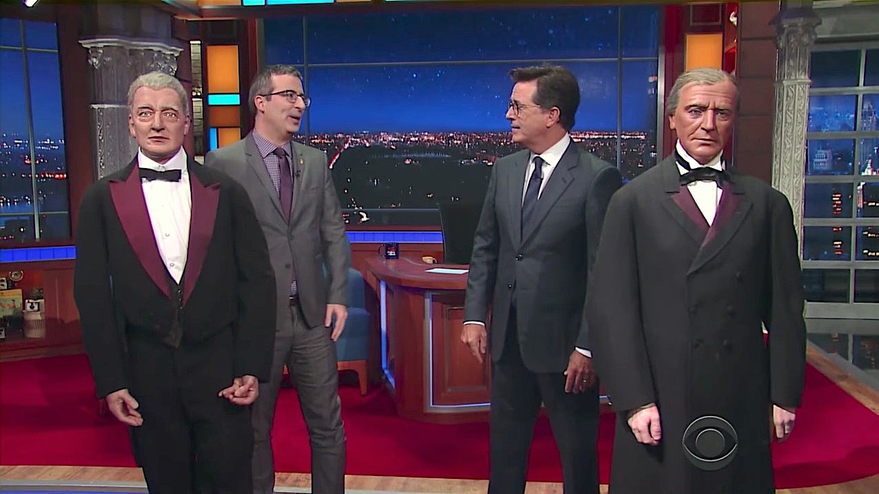 John Oliver and Stephen Colbert spar over wax statues