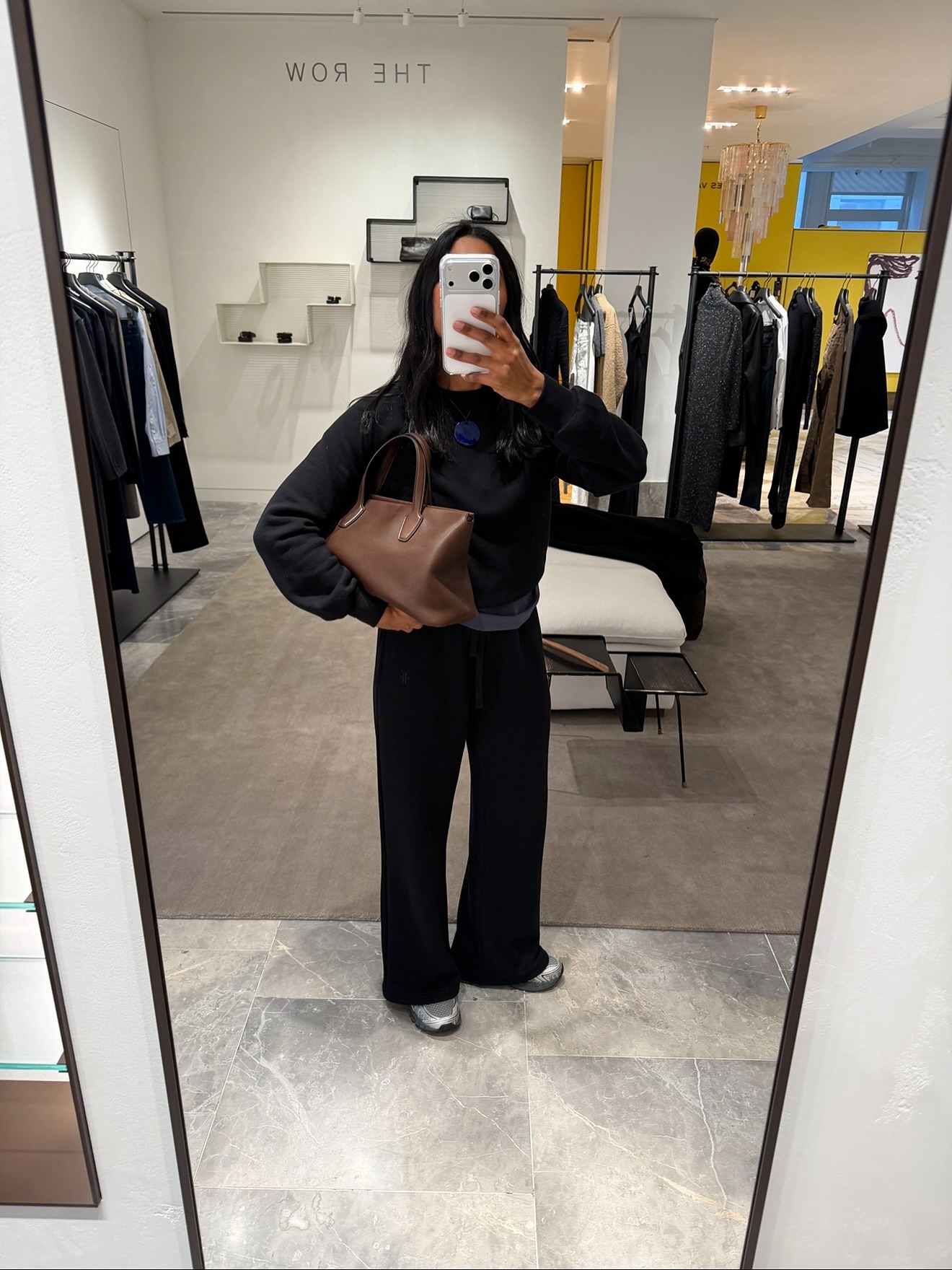 Monikh wearing The Row Marcel bag