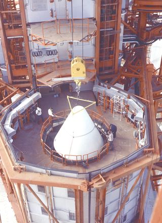 The nose cone for the Saturn IBC rocket carrying NASA's uncrewed Apollo 5 mission is fitted into place at NASA's Kennedy Space Center in this photo taken Nov. 1, 1967. The mission launched on Jan. 22, 1968.