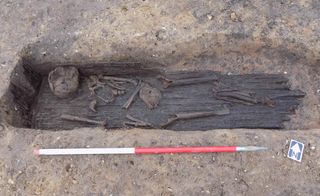The archaeologists also discovered some graves that had been carved into the ground and lined with wooden planks.