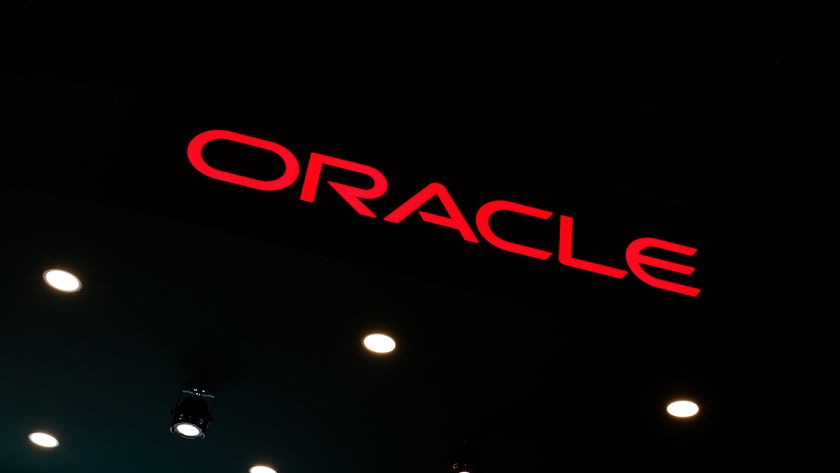 Oracle logo pictured in red lettering against a black background at the company&#039;s stall at Mobile World Congress (MWC) 2025 in Barcelona, Spain.