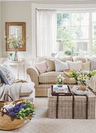 picture of living room with light neutral furnishing and spring florals