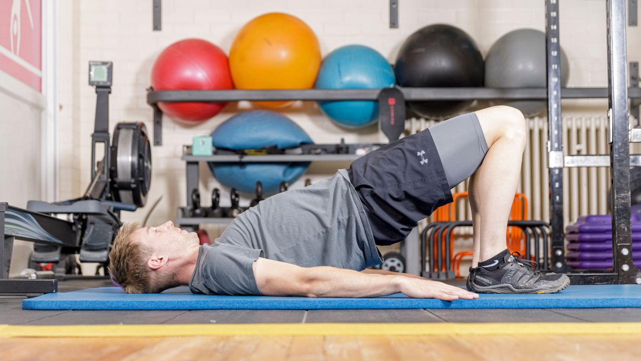 Image shows a person completing a dynamic warm up before cycling in the winter