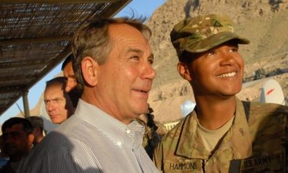 House Speaker John Boehner, left, with an Ohio solider stationed in Afghanistan in 2011