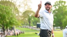 Michael Block puts a finger up on the 18th hole green during the final round of the 2023 PGA Championship at Oak Hill Country Club on May 21, 2023