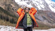 Woman wearing an outdoor jacket in the mountains
