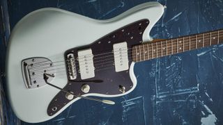 Squier Jazzmaster on blue background 