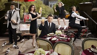 A promo shot for the TV show 30 Rock in which Tina Fey is holding a bottle of mustard and Alec Baldwin is holding a drink to the camera.