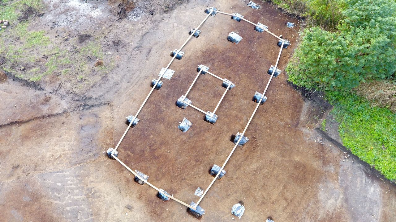 The Old Norse "god house" was built from wood about 1200 years ago to worship gods like Odin, Thor, and Freyr. Post-holes that show its distinctive shape, including its central tower, have been unearthed at the site.