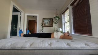 Our lead reviewer Alex lies on the Leesa Oasis Chill Hybrid to gauge how comfy it is in different sleeping positions