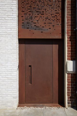 Modern rust-colored steel front door