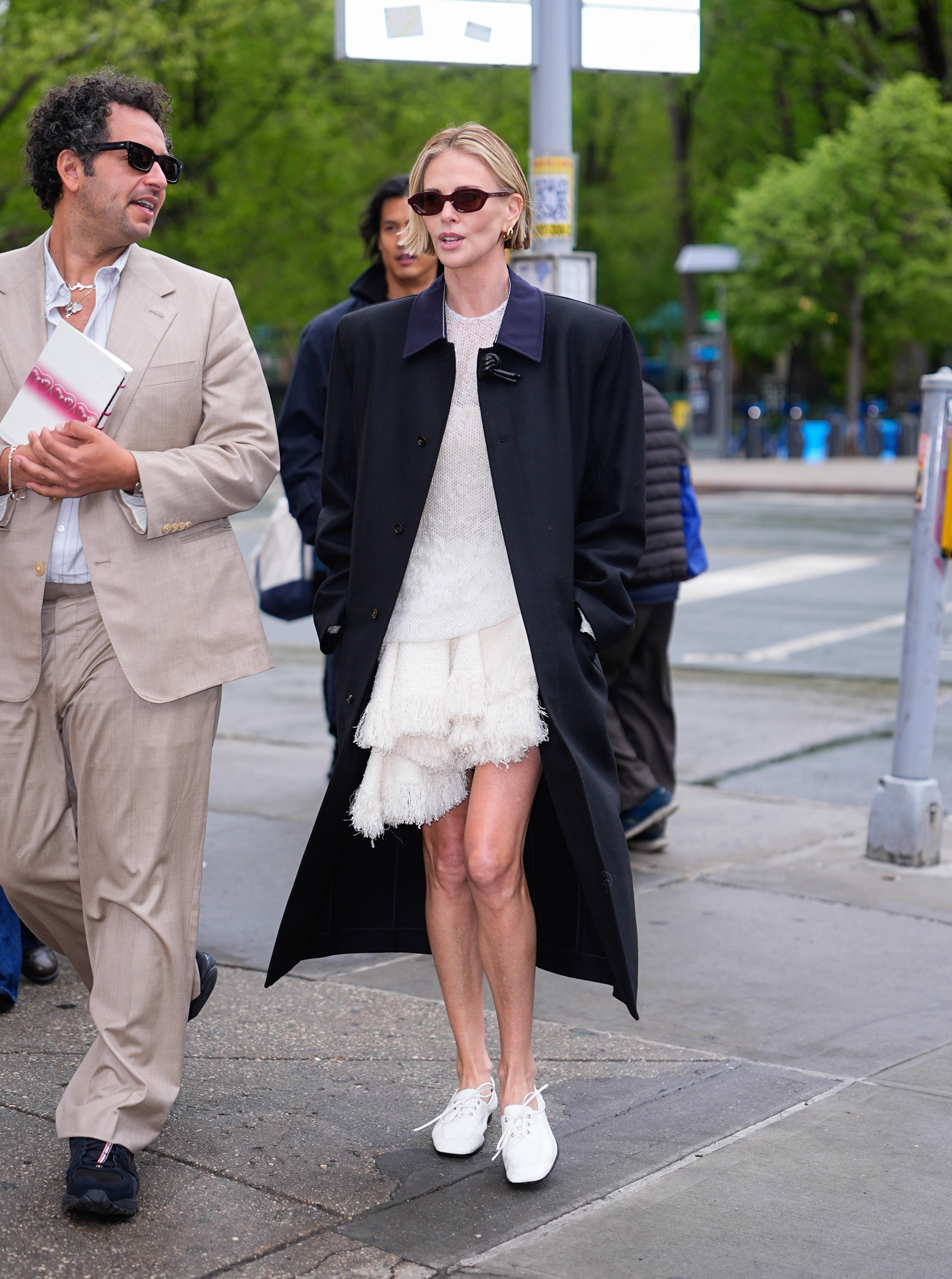 NEW YORK, NY - APRIL 22: Kareem Rahma and Charlize Theron are seen on April 22, 2026 in New York City.