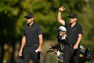 Corey Conners and Mackenzie Hughes of Canada and the International Team celebrate on the 11th green during Friday Foursomes on day two of the 2024 Presidents Cup at The Royal Montreal Golf Club on September 27, 2024 in Montreal, Quebec, Canada.