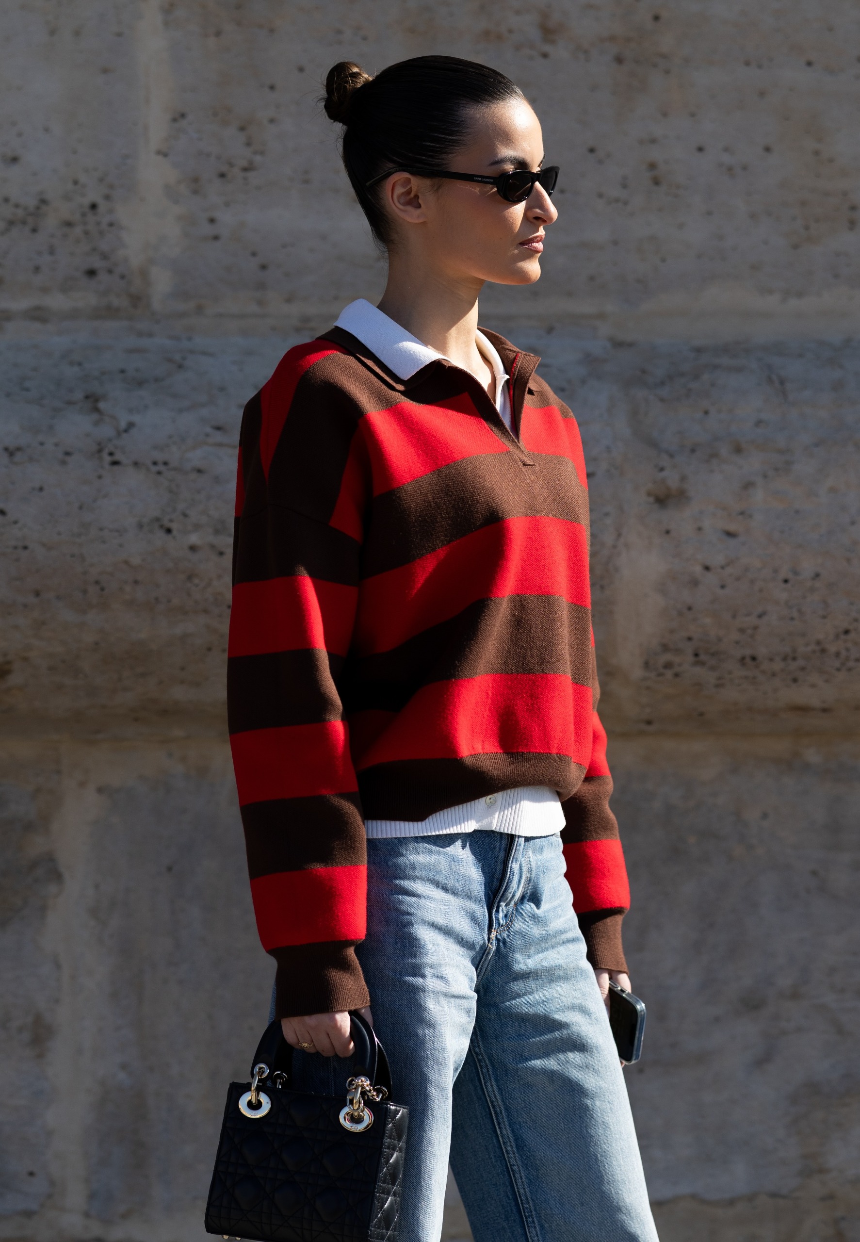 woman wearing striped sweater street style