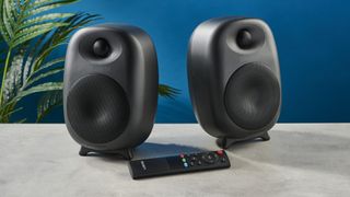 the majority d80 speakers, a pair of black egg-shaped speakers with mesh casing, HDMI, bluetooth, aux connectivity