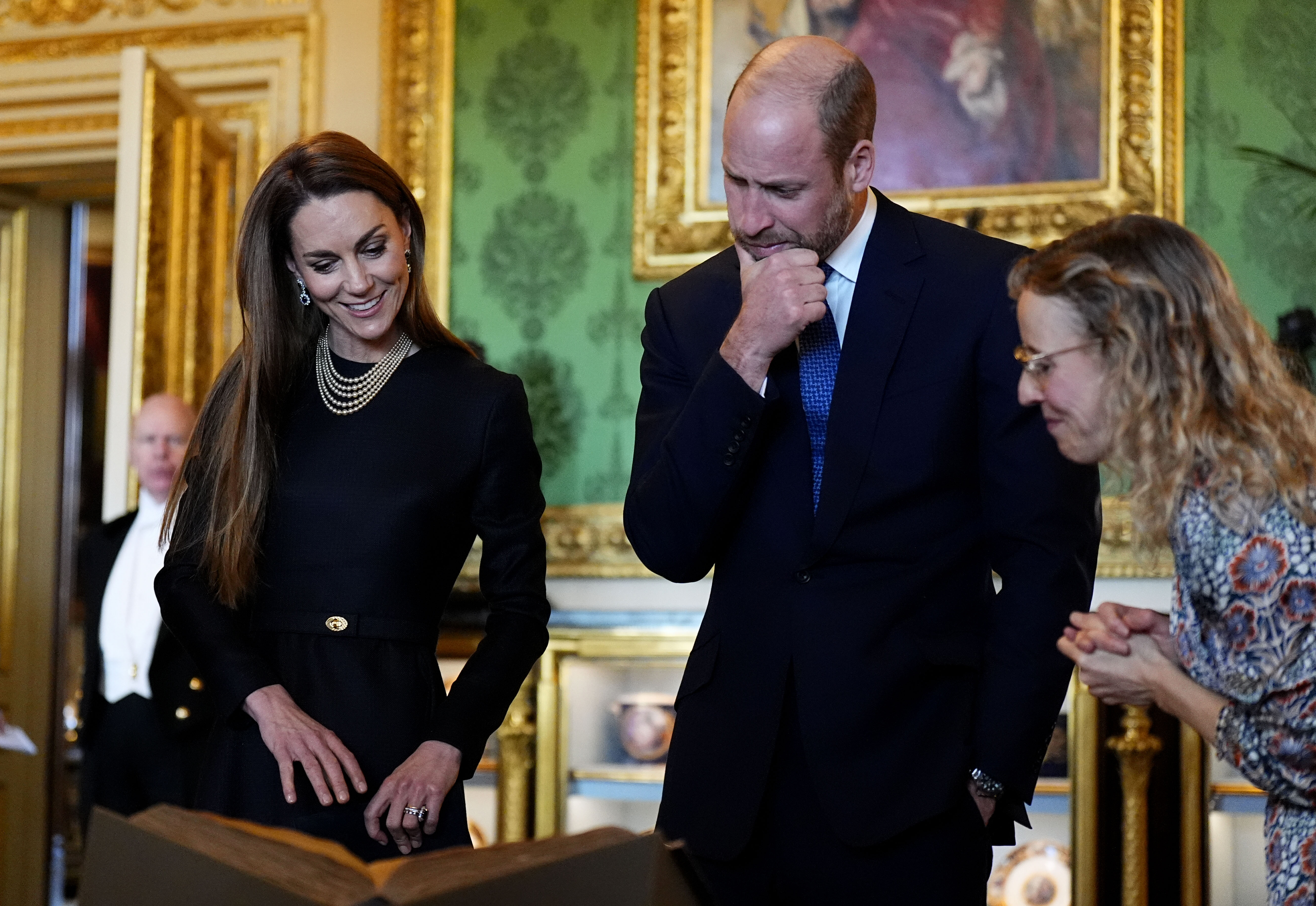 Kate Middleton and Prince William looking at artwork
