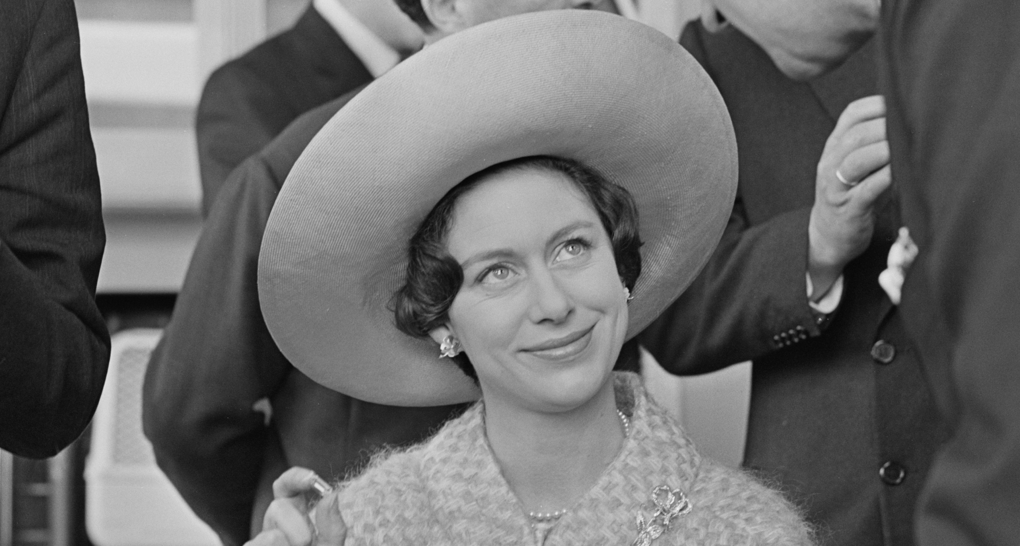 Princess Margaret wearing a large hat and looking up 