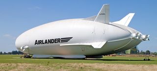 The hybrid airship 'Airlander,' tethered at Cardington, United Kingdom, combines airship technology with elements from helicopters and fixed wing aircraft.
