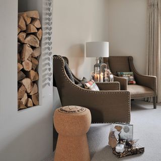 living room seating with armchair and wood stacks
