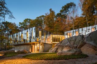 Exterior of Pound Ridge House, set in a forest in upstate New York, USA