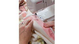 A person using a sewing machine, used to illustrate a w&h article on the best sewing machines