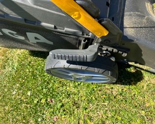 side view of a wheel on a petrol mower