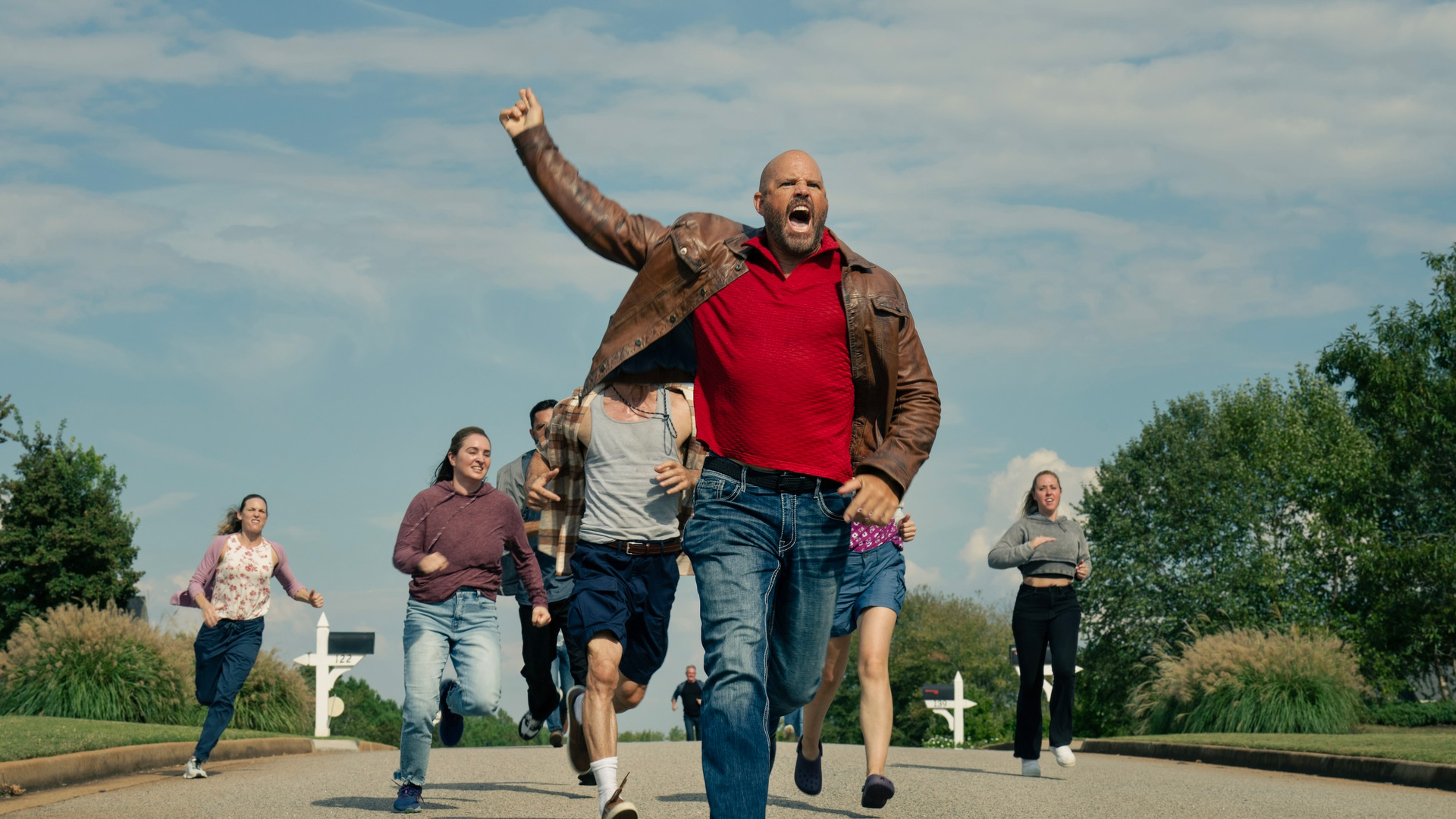 Keith (David Denman) leads a group of people chasing after Adebayo in Peacemaker season 2, episode 6.