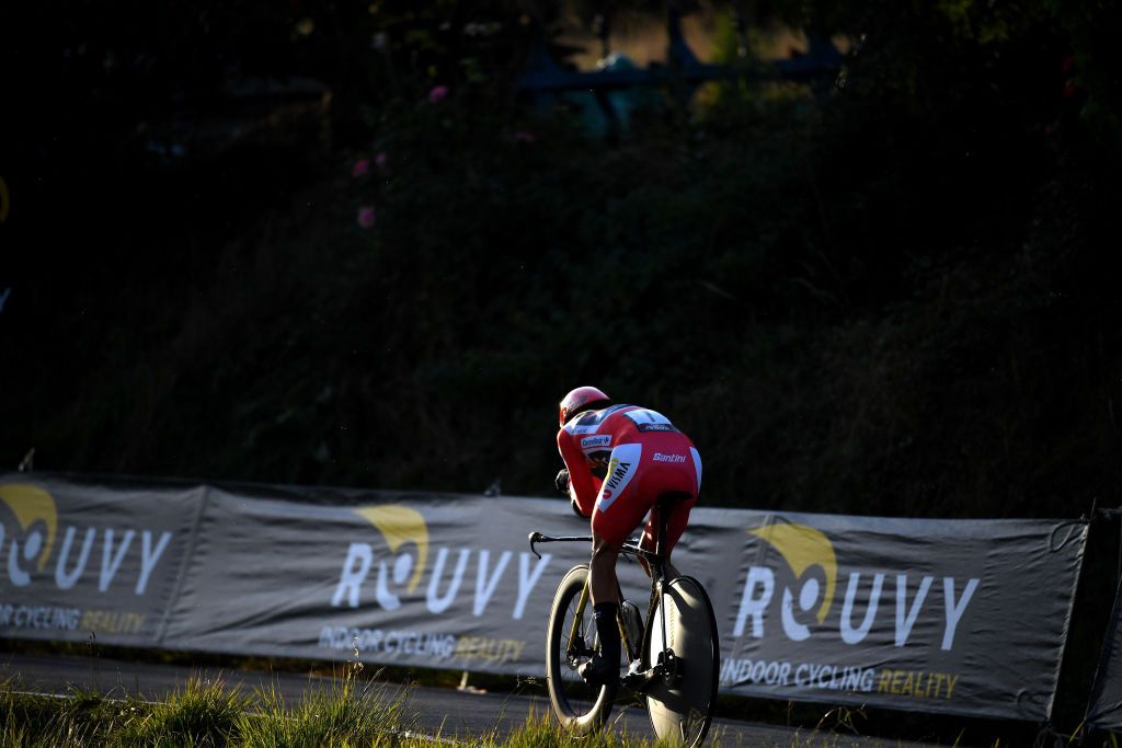 SANTIAGO DE COMPOSTELA SPAIN SEPTEMBER 05 Primoz Roglic of Slovenia and Team Jumbo Visma red leader jersey sprints during the 76th Tour of Spain 2021 Stage 21 a 338 km Individual Time Trial stage from Padrn to Santiago de Compostela lavuelta LaVuelta21 ITT on September 05 2021 in Santiago de Compostela Spain Photo by Tim de WaeleGetty Images