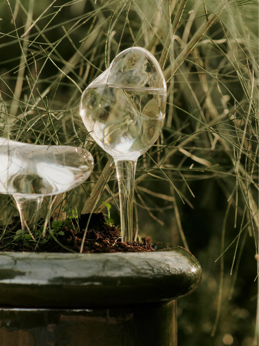 A pair of glass watering globes from Ferm Living