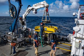 Scientists aboard the Exploration Vessel Nautilus launch the ROV Hercules to search for meteorite fragments off the coast of Washington state.