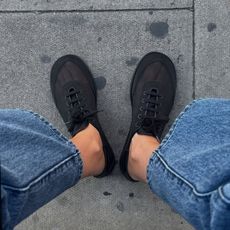 An image of @lizzyhadfield wearing teh mesh trainer trend.