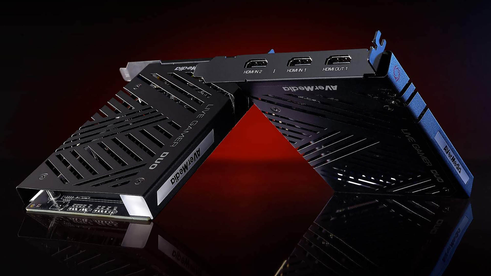 Stylised shot of two Avermedia Live Gamer Duo capture cards leaning on each other on a red and black background