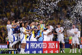 Players of Leeds United celebrate promotion during the Sky Bet Championship match between Leeds United FC and Bristol City FC at Elland Road on April 28, 2025 in Leeds, England.