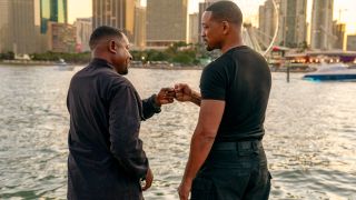 Martin Lawrence and Will Smith fist bump on the water in Bad Boys: Ride or Die.