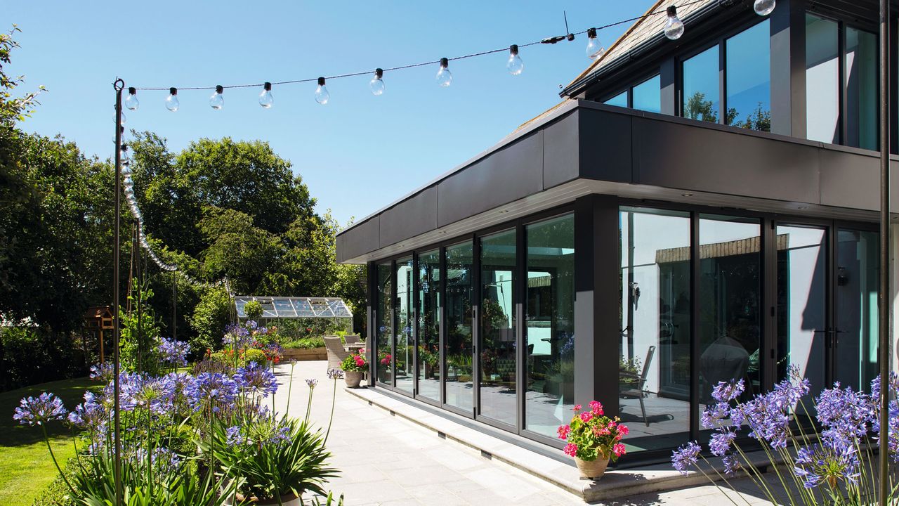 Festoon outdoor lights hanging outside house exterior