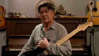 FEB. 6, 2014. Robbie Robertson, lead guitarist for the the legendary rock group The Band, holds a Fender Stratocaster