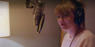 Taylor Swift recording a song