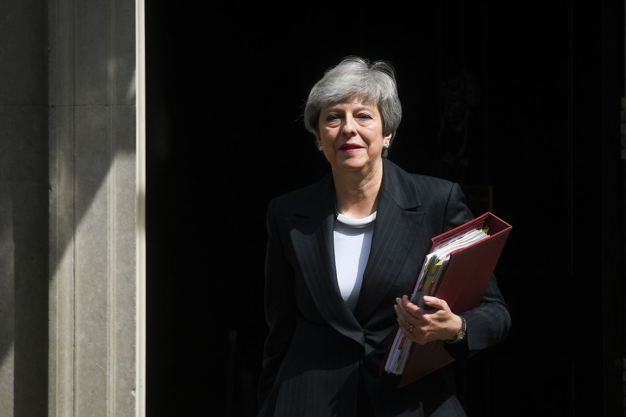 Theresa May walks from 10 Downing Street