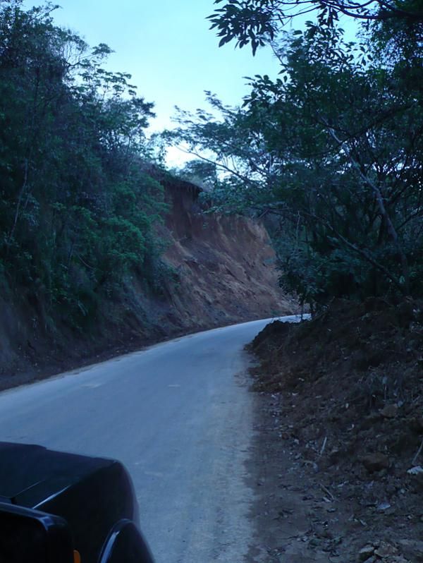 Passing through landslide territory on a road that's part of the end of stage 1.