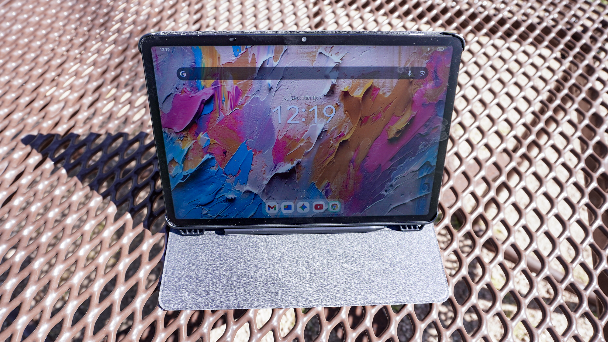 The TCL NXTPAPER 11 Plus on a table outside on a sunny day showing off how capable its matte display is