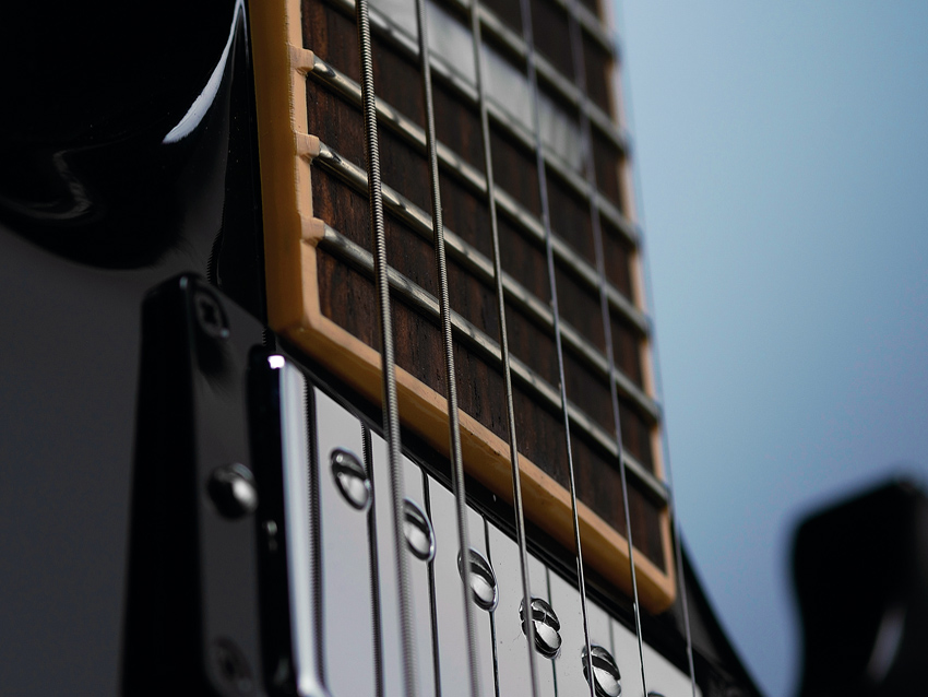 The extra frets don't add anything to the SG's neck, only the fingerboard.