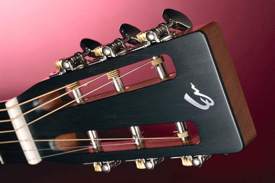 The 000R's slot headstock with open geared tuners.