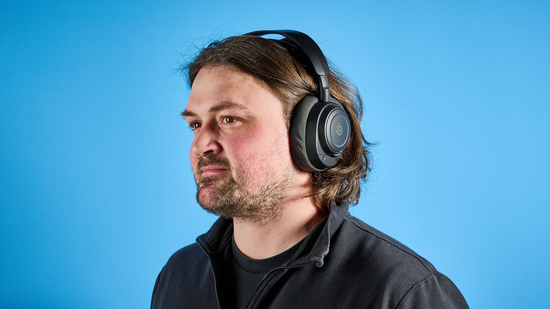 The SteelSeries Arctis Nova 7 Gen 2 against a blue background