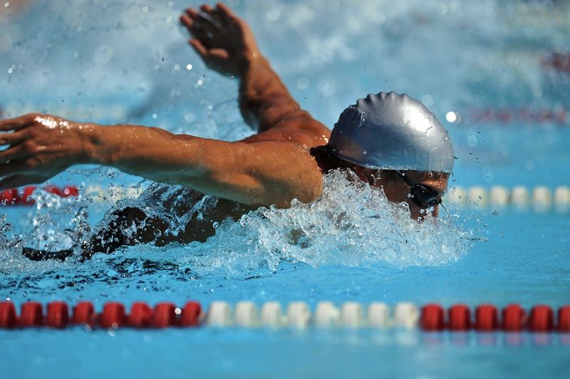 Racing the butterfly stroke.