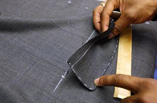 LONDON - AUGUST 19:Bespoke Tailors create suits at Gieves and Hawkes on Saville Row on August 18, 2008 in London, England. A bespoke two piece suit takes up to eight weeks to make and start a
