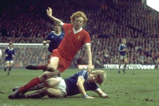 David Fairclough of Liverpool is tackled by an Everton player in 1977.