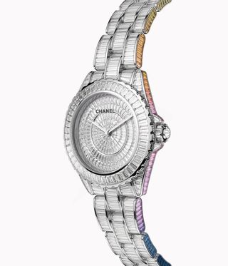 Chanel diamond watch with rainbow coloured sapphires going up the side