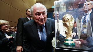 Former FIFA president Sepp Blatter with the World Cup trophy in Brazil in 2014.